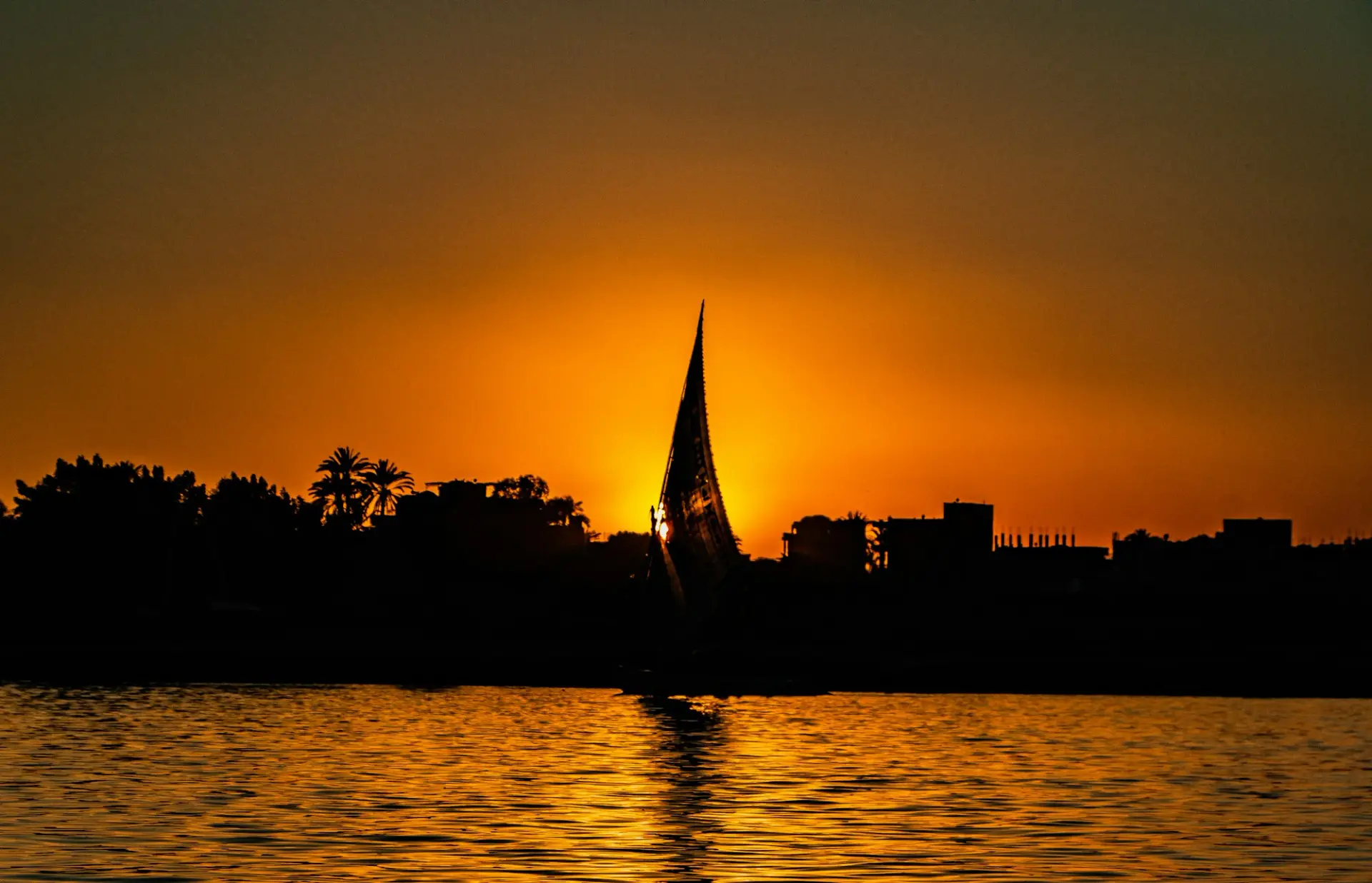 A felucca sailing on the Nile at sunset in Luxor